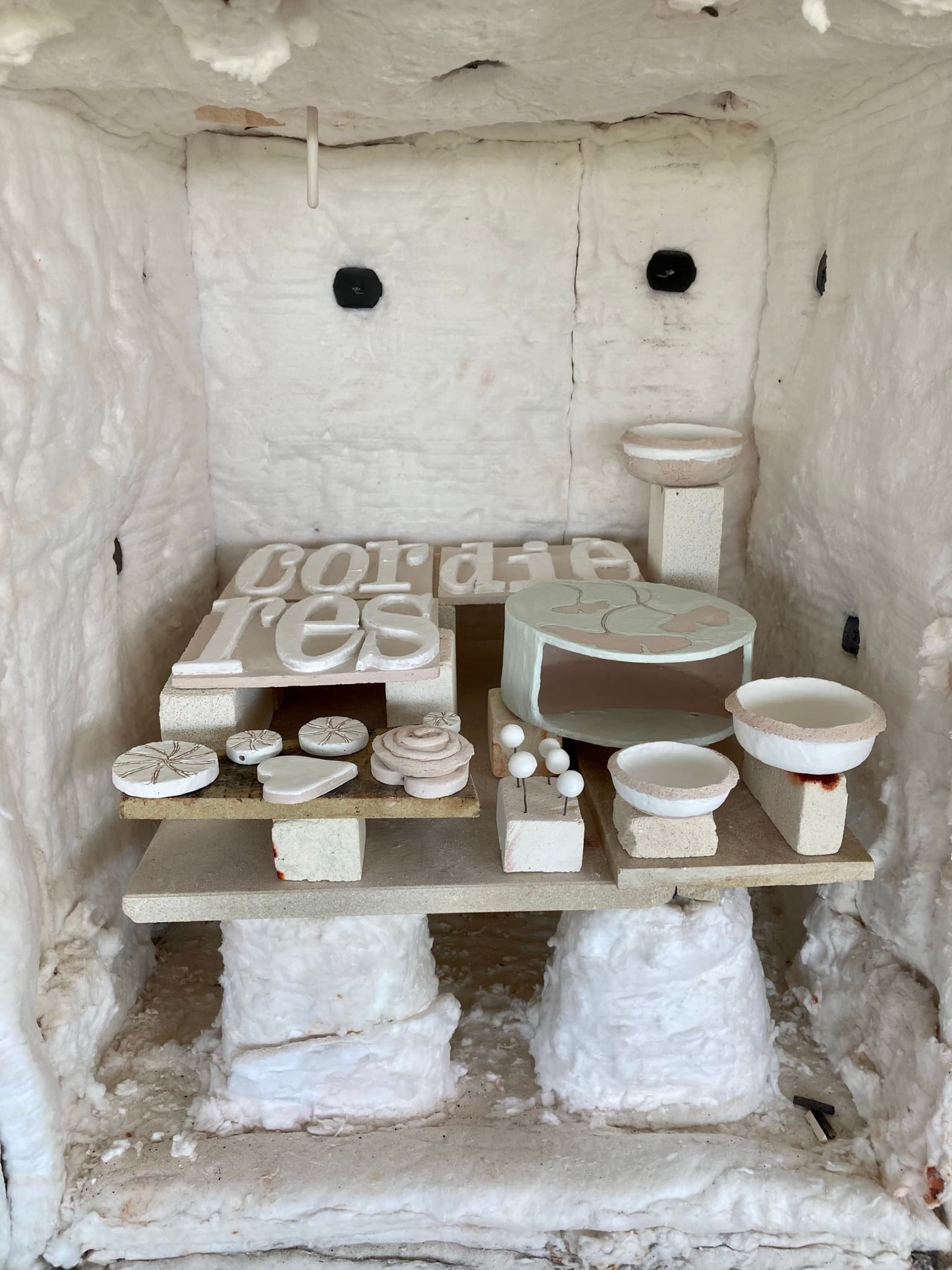 After glazing, loading the outdoor Raku kiln